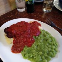 Vegan sausage, mushed peas, roasted tomato sauce and mustard mashed potato at The Old Nags Head in Edale
