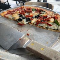 Our half eaten greek pizza at Blue Line Pizza in Campbell