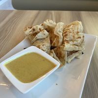 Roti canai- spicy coconut sauce (really good!)  at Padmanadi Vegan Eatery in Calgary