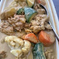 Chicken curry.  Rich and mildly spiced. Great chicken. at Padmanadi Vegan Eatery in Calgary