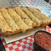 Vegan cheesy garlic breadsticks   at Twisted Sourdough in Henderson