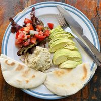 Hummus w/ avocado, tomato & pita (95 THB)  at Om Garden Cafe in Pai