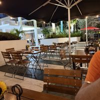 Outdoor seating is just in front of the restaurant with a pedestrian walkway in between  at Spris Artisan Pizza in Miami Beach