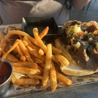 Vegan Italian beef handheld with fries  at Alter Brewing + Kitchen in Oak Brook