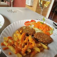 Spinach and quinoa burgers with fries and bravas sauce plus mixed salad. at Los Canarios Albergue in Calzadilla De La Cueza