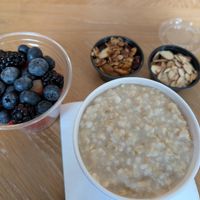 Oatmeal with toppings, fresh fruit for takeout at TRACE Market in Seattle