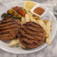 Patties with grilled vegetables and fries at Captain Cook in Nafpaktos