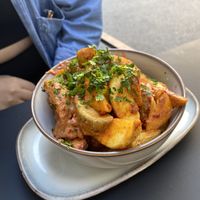 Spicy potato wedges. Got a real kick!  at NOOR Lounge & Restaurant in Budapest