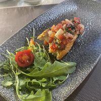 Tomato bruschetta (This is only half of one and there was two on the plate but forgot to take a picture before sorry!)  at The View Bar & Kitchen in Zebbug