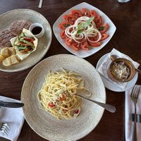 Spaghetti aglio e olio with vegan cheese, vegan bifteki and tomato salad ☺️  at Konstantin Restaurant Cafe in Rhodes