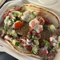 Gyro wrap - tender lentil gyro on a soft pita topped with garden greens, quinoa tabouli, & taziki   at The Plot Express in Carlsbad