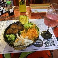 Veggie ramen + strawberry soda (served on an anime colouring sheet)   at Ramen House in Bogota