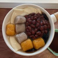 Soya and black jelly dessert topped with taro & sweet potato balls, red bean. Brown sugar syrup on the side. Tasted great and love all the textures  at Blackball in Penang