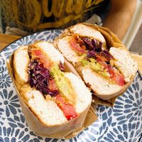 Vegan bagel with peanut butter, avocado and tomato at Mälis in Biarritz