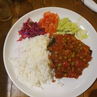 DELICIOUS aubergine with rice and salad. Do not let the simplicity of the picture fool you! at Dinosaur Cafe in Exeter