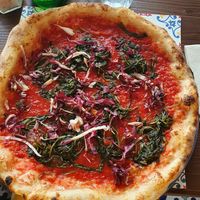 Red pizza with veggies at Pizzium - Trento  in Trento