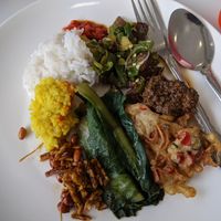 A vegan plate from the grand opening buffet. Yellow rice, greens, sambal, a beans and 'beef' dish, rendang, and fried Enoki mushrooms. at Wang Bu Liao Vegetarian 忘不了 in Batam