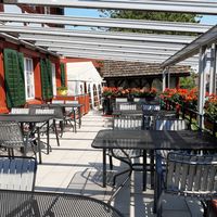 Outdoor seating at Wirtschaft zum Eigenhof in Weinfelden