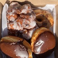 Boston cream, apple fritter, and maple bac'n  at Just Fine Donuts in Alexandria