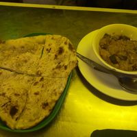 Garlic naan not really good 10k kips. Egg plant curry 22k kips was so good!! at Nisha Restaurant in Luang Prabang