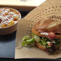 Bavarian burger with classic fries at Swing Kitchen - Invalidenstraße  in Vienna