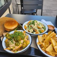 New chicken burger, loaded fries and cesar salad bowl at Swing Kitchen - Invalidenstraße  in Vienna