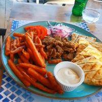 Gyros. With sweet potato fries on recuest. Verry tastes but the gyros was not enough. My friend wanted to eat 3 times that amount. at Tásos in Zakynthos