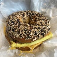 Breakfast bagel sandwich with tofu egg and vegan cheese and sausage  at Petunia's Pies and Pastries in Portland