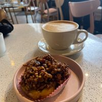Latte with oat and vegan pecan sticky bun  at Petunia's Pies and Pastries in Portland
