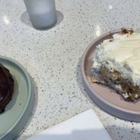 Boston Creme Doughnut and Regular Cinnamon Roll  at Petunia's Pies and Pastries in Portland