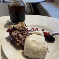 Marionberry pie with hazelnut and a scoop of vanilla ice cream. Amazing ice cream! at Petunia's Pies and Pastries in Portland
