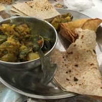 Excellent vegetable sabji with roti and samosas    at Shere Panjab in Leicester