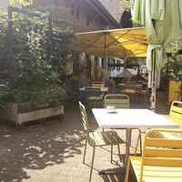 Outdoor seating at N'AU Café in Volketswil