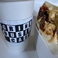 lavender oat milk latte + vegan herbasaur jr. chorizo breakfast sandwich  at Grindhouse Cafe in Griffith