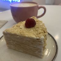 Neapolitan cake with hazelnut milk latte   at Healpies Almaty  in Almaty