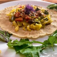 Selfmade Naanbrot with herbs from the garden at Pinakarri in Luzern