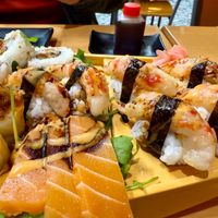 Sushi boat upclose showing Shrimp Nigiri and Sashimi Salmon at Vegan Sushi House  in Lisbon