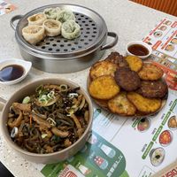 Mix vegetable and kimchi dumplings pancakes and soy sauce noodles  at Bibibim in Busan