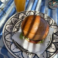 Falafel burger with orange juice   at Restaurant La Réception in Tangier