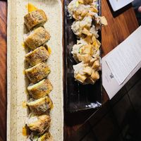 Left: dragon roll (tastes more like salmon skin), right: baked scallop roll (too bad they don’t tableside flambé anymore)  at Shojin - Culver City in Culver City