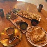 Masala chai, samosas, papads (and chips for my friend's kid).  at Ahaara Veda Indian in Koh Phangan