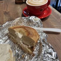 Bagel with coffee from next door cafe  at Bagels on the Square in New York City