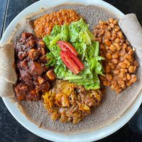 (clockwise) lentils, fava beans, cabbage, mushroom/potatoes   at Muzita Abyssinian Bistro in San Diego