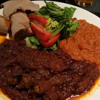 Bamya Berebere Basil. Okra in a rich sauce with side of spicy lentils at Muzita Abyssinian Bistro in San Diego