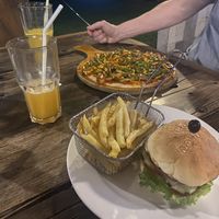 + veg burger with fries  at The Kitchen Flavour Restaurant in Moshi