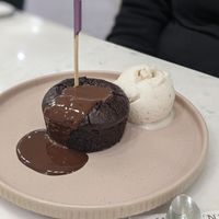 Cookie Dough Brownie with chocolate sauce. at Heavenly Desserts  in North West London