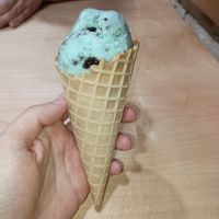 Mint Oreo dairy-free ice cream with a waffle cone at Legendairy Cookies 'N Creamery in Appleton