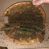 Oat dough manakish with veggies  at Operation Falafel  in Abu Dhabi