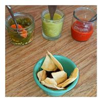Appetizer: Chips & Hibiscus with 3 hot sauces: Jalapeño, Salsa Verde, Chile Arbol. at Selva Taqueria Plantbased in Cabo San Lucas
