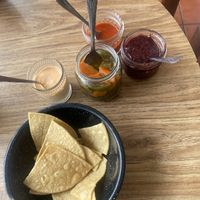 Chips and some salsas which  at Selva Taqueria Plantbased in Cabo San Lucas